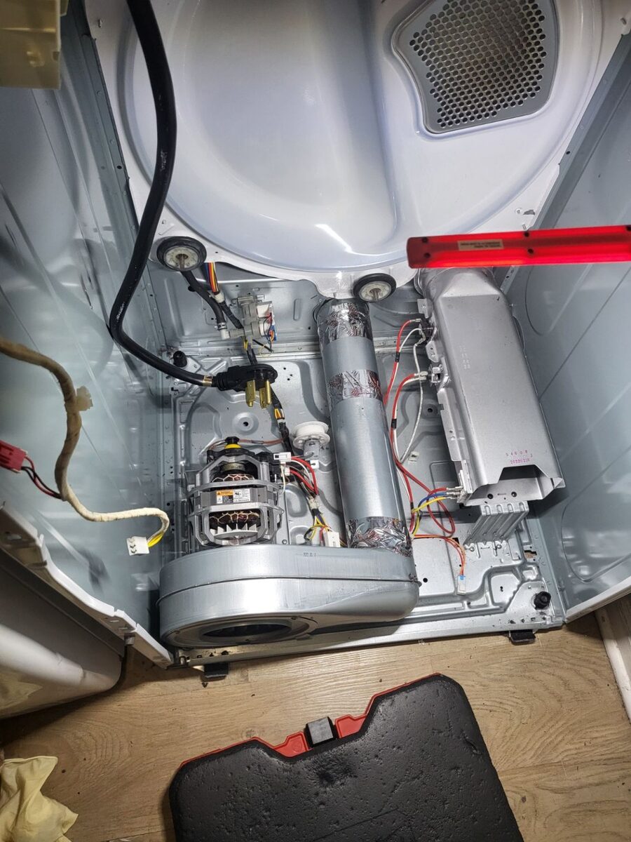 Inside a clothes dryer during professional diagnostic service